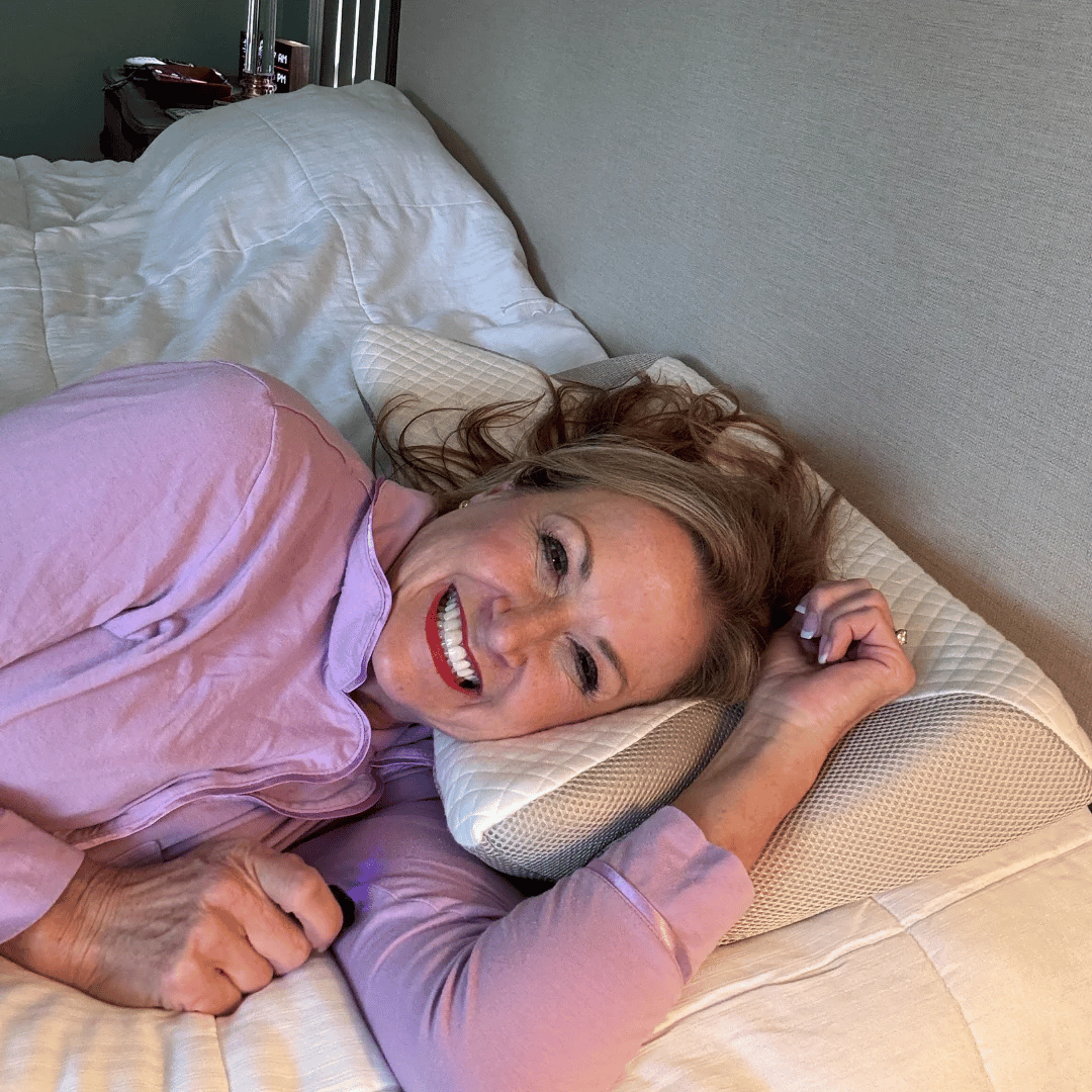 Woman sleeping comfortably on The Neck Therapy Pillow